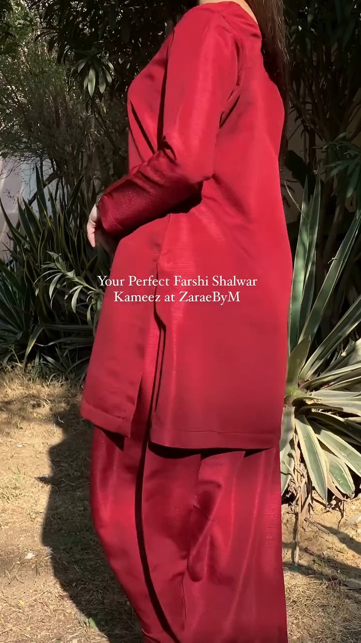 Person wearing a red outfit with text overlay in an outdoor setting