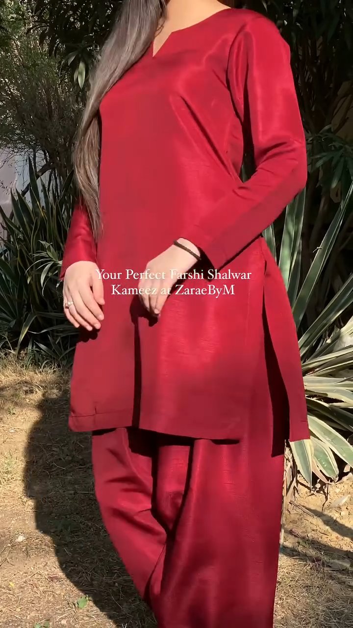 Red outfit with text overlay on a natural background